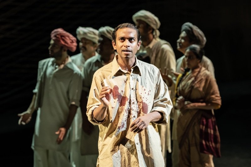Hiran-Abeysekera-Nathuram-Godse-and-The-Father-and-the-Assassin-company-at-the-National-Theatre-2023.-Credits-Marc-Brenner Hiran-Abeysekera-Nathuram-Godse-and-The-Father-and-the-Assassin-company-at-the-National-Theatre-2023.-Credits-Marc-Brenner