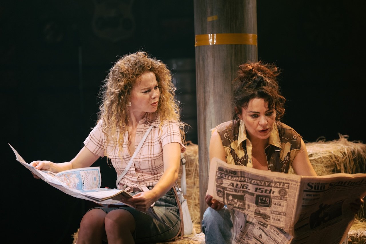 Thelma & Louise by Callie Khouri;
Production Photography;
Cast: Rachel Tucker, Amy Lennox, Jordan Luke Gage, Trevor Dion Nicholas, Samuel Edwards, Alex Gibson-Giorgio, Tamlyn Henderson, Letitia Hector;
Book by Callie Khouri;
Music & Lyrics by Neko Case;
Directed by Trip Cullman;
Choreography by Bobbi Jene Smith and Or Schraiber;
Musical Supervisor Kimberly Grigsby;
Scenography by Christine Jones and Brett J. Banakis;
Costume Design by Ryan Dawson Laight;
Lighting Design by Natasha Chivers;
Sound Design by Gareth Owen;
Orchestrator & Arranger John Clancy;
Music Director Ed Bussey;
Additional Music by Carl Newman, Paul Rigby and Zoe Sarnak;
Creative Producer Mandy Greenfield;
Creative Consultant Imogen Brodie;
Casting Director Stuart Burt CDG CSA;
Casting Associate Peter Noden;
Wigs, Hair and Make-Up Design by Carole Hancock;
Fight Director Kev McCurdy;
Voice & Dialect Coach Danièle Lydon;
Armourer Bare Arms;
Costume Supervisor Zoë Thomas-Webb;
Props Supervisor Mary Halliday;
Keyboard Programming by Billy Jay Stein and Hiro Iida for Strange Cranium;
Copyist J&J Music Preparation;
Associate Director Chelsea Walker;
Associate Choreographer Lily Ockwell;
Associate Designer Matthew Buttrey;
Associate Lighting Designer Stacey O'Shea;
Associate Sound Designer Rob Jones;
Jerwood Assistant Director Francesca Murray-Fuentes;
Music Producer Jeff Galegher;
Orchestra Manager Sylvia Addison;
US General Managers RCI Theatricals;
Production Managers Gary Beestone and Oli Bagwell Purefoy;
Company Stage Manager Matt Elesmore;
Deputy Stage Manager Hannah Halden;
Assistant Stage Manager (Book Cover) Frances Howell;
Assistant Stage Manager Jasmine Smith;
Young Vic, London, UK;
3 September 2026;
Photo: Helen Murray Thelma & Louise by Callie Khouri;
Production Photography;
Cast: Rachel Tucker, Amy Lennox, Jordan Luke Gage, Trevor Dion Nicholas, Samuel Edwards, Alex Gibson-Giorgio, Tamlyn Henderson, Letitia Hector;
Book by Callie Khouri;
Music & Lyrics by Neko Case;
Directed by Trip Cullman;
Choreography by Bobbi Jene Smith and Or Schraiber;
Musical Supervisor Kimberly Grigsby;
Scenography by Christine Jones and Brett J. Banakis;
Costume Design by Ryan Dawson Laight;
Lighting Design by Natasha Chivers;
Sound Design by Gareth Owen;
Orchestrator & Arranger John Clancy;
Music Director Ed Bussey;
Additional Music by Carl Newman, Paul Rigby and Zoe Sarnak;
Creative Producer Mandy Greenfield;
Creative Consultant Imogen Brodie;
Casting Director Stuart Burt CDG CSA;
Casting Associate Peter Noden;
Wigs, Hair and Make-Up Design by Carole Hancock;
Fight Director Kev McCurdy;
Voice & Dialect Coach Danièle Lydon;
Armourer Bare Arms;
Costume Supervisor Zoë Thomas-Webb;
Props Supervisor Mary Halliday;
Keyboard Programming by Billy Jay Stein and Hiro Iida for Strange Cranium;
Copyist J&J Music Preparation;
Associate Director Chelsea Walker;
Associate Choreographer Lily Ockwell;
Associate Designer Matthew Buttrey;
Associate Lighting Designer Stacey O'Shea;
Associate Sound Designer Rob Jones;
Jerwood Assistant Director Francesca Murray-Fuentes;
Music Producer Jeff Galegher;
Orchestra Manager Sylvia Addison;
US General Managers RCI Theatricals;
Production Managers Gary Beestone and Oli Bagwell Purefoy;
Company Stage Manager Matt Elesmore;
Deputy Stage Manager Hannah Halden;
Assistant Stage Manager (Book Cover) Frances Howell;
Assistant Stage Manager Jasmine Smith;
Young Vic, London, UK;
3 September 2026;
Photo: Helen Murray