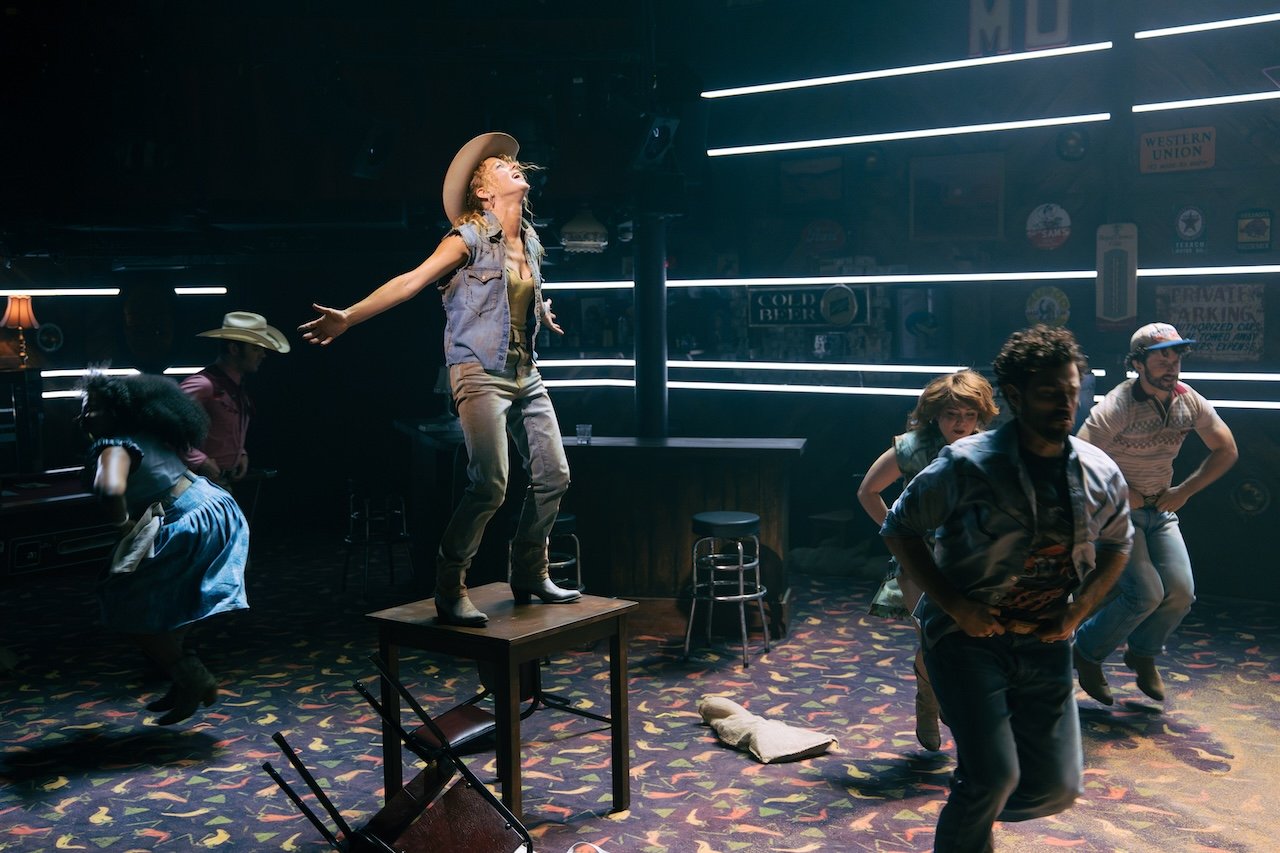 Thelma & Louise by Callie Khouri;
Production Photography;
Cast: Rachel Tucker, Amy Lennox, Jordan Luke Gage, Trevor Dion Nicholas, Samuel Edwards, Alex Gibson-Giorgio, Tamlyn Henderson, Letitia Hector;
Book by Callie Khouri;
Music & Lyrics by Neko Case;
Directed by Trip Cullman;
Choreography by Bobbi Jene Smith and Or Schraiber;
Musical Supervisor Kimberly Grigsby;
Scenography by Christine Jones and Brett J. Banakis;
Costume Design by Ryan Dawson Laight;
Lighting Design by Natasha Chivers;
Sound Design by Gareth Owen;
Orchestrator & Arranger John Clancy;
Music Director Ed Bussey;
Additional Music by Carl Newman, Paul Rigby and Zoe Sarnak;
Creative Producer Mandy Greenfield;
Creative Consultant Imogen Brodie;
Casting Director Stuart Burt CDG CSA;
Casting Associate Peter Noden;
Wigs, Hair and Make-Up Design by Carole Hancock;
Fight Director Kev McCurdy;
Voice & Dialect Coach Danièle Lydon;
Armourer Bare Arms;
Costume Supervisor Zoë Thomas-Webb;
Props Supervisor Mary Halliday;
Keyboard Programming by Billy Jay Stein and Hiro Iida for Strange Cranium;
Copyist J&J Music Preparation;
Associate Director Chelsea Walker;
Associate Choreographer Lily Ockwell;
Associate Designer Matthew Buttrey;
Associate Lighting Designer Stacey O'Shea;
Associate Sound Designer Rob Jones;
Jerwood Assistant Director Francesca Murray-Fuentes;
Music Producer Jeff Galegher;
Orchestra Manager Sylvia Addison;
US General Managers RCI Theatricals;
Production Managers Gary Beestone and Oli Bagwell Purefoy;
Company Stage Manager Matt Elesmore;
Deputy Stage Manager Hannah Halden;
Assistant Stage Manager (Book Cover) Frances Howell;
Assistant Stage Manager Jasmine Smith;
Young Vic, London, UK;
3 September 2026;
Photo: Helen Murray Thelma & Louise by Callie Khouri;
Production Photography;
Cast: Rachel Tucker, Amy Lennox, Jordan Luke Gage, Trevor Dion Nicholas, Samuel Edwards, Alex Gibson-Giorgio, Tamlyn Henderson, Letitia Hector;
Book by Callie Khouri;
Music & Lyrics by Neko Case;
Directed by Trip Cullman;
Choreography by Bobbi Jene Smith and Or Schraiber;
Musical Supervisor Kimberly Grigsby;
Scenography by Christine Jones and Brett J. Banakis;
Costume Design by Ryan Dawson Laight;
Lighting Design by Natasha Chivers;
Sound Design by Gareth Owen;
Orchestrator & Arranger John Clancy;
Music Director Ed Bussey;
Additional Music by Carl Newman, Paul Rigby and Zoe Sarnak;
Creative Producer Mandy Greenfield;
Creative Consultant Imogen Brodie;
Casting Director Stuart Burt CDG CSA;
Casting Associate Peter Noden;
Wigs, Hair and Make-Up Design by Carole Hancock;
Fight Director Kev McCurdy;
Voice & Dialect Coach Danièle Lydon;
Armourer Bare Arms;
Costume Supervisor Zoë Thomas-Webb;
Props Supervisor Mary Halliday;
Keyboard Programming by Billy Jay Stein and Hiro Iida for Strange Cranium;
Copyist J&J Music Preparation;
Associate Director Chelsea Walker;
Associate Choreographer Lily Ockwell;
Associate Designer Matthew Buttrey;
Associate Lighting Designer Stacey O'Shea;
Associate Sound Designer Rob Jones;
Jerwood Assistant Director Francesca Murray-Fuentes;
Music Producer Jeff Galegher;
Orchestra Manager Sylvia Addison;
US General Managers RCI Theatricals;
Production Managers Gary Beestone and Oli Bagwell Purefoy;
Company Stage Manager Matt Elesmore;
Deputy Stage Manager Hannah Halden;
Assistant Stage Manager (Book Cover) Frances Howell;
Assistant Stage Manager Jasmine Smith;
Young Vic, London, UK;
3 September 2026;
Photo: Helen Murray