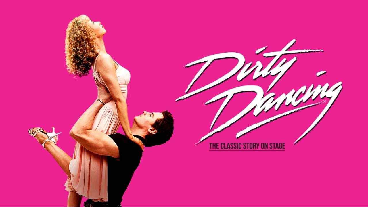 Promotional artwork for Dirty Dancing: a couple in a dance lift pose against a bright pink background, with the show's logo reading 'The Classic Story on Stage.