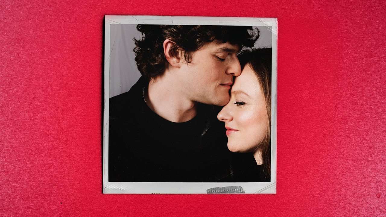 A couple cuddling. Poster for Guess How Much I Love You? - Royal Court Theatre London. Photo via PR