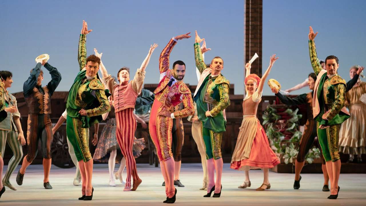 Carlos Acosta's Don Quixote dancers in vibrant costumes at Birmingham Royal Ballet, 2022.
