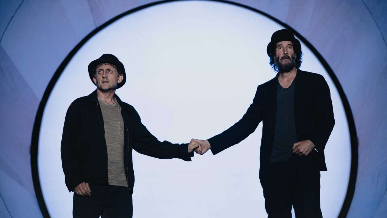 Keanu Reeves and Alex Winter holding hands in Waiting for Godot