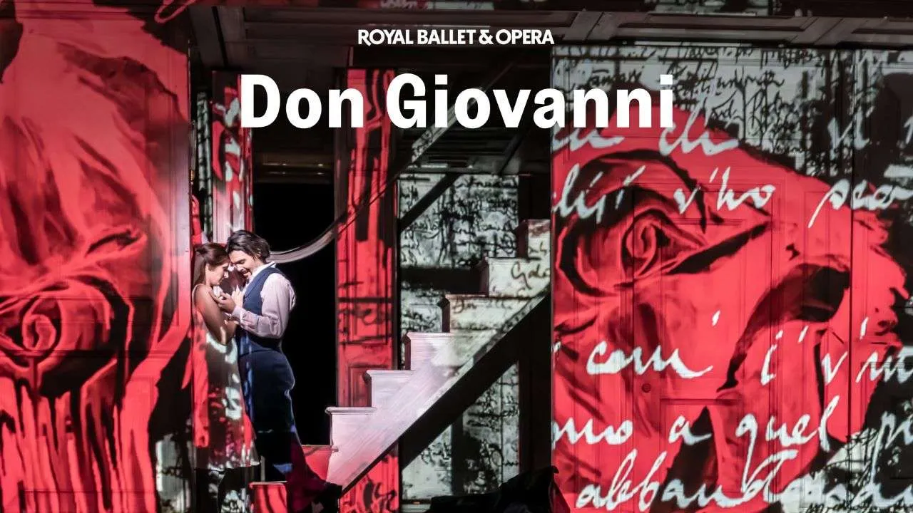 Promotional image for Don Giovanni by Royal Ballet & Opera, showing a couple embracing on a stairway in front of bold red graffiti art.