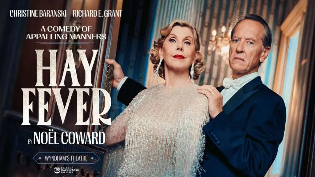 Poster for the play Hay Fever featuring Christine Baranski and Richard E. Grant in formal attire at Wyndham's Theatre, with the subtitle A Comedy of Appalling Manners.