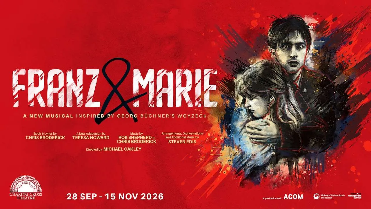 Promotional red poster for the musical Franz & Marie, showing a couple embracing on the right with bold white title across the left and dates 28 Sep – 15 Nov 2026 at Charing Cross Theatre.