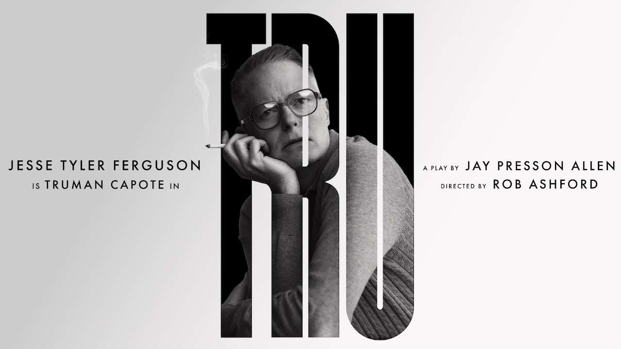 Theatrical poster for Truman Capote with Jesse Tyler Ferguson; black-and-white portrait of a man smoking, over large vertical letters TRU M AN.
