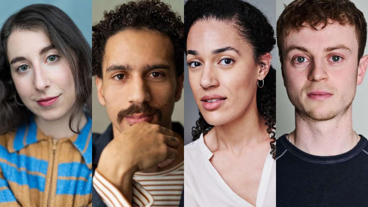 Group portrait of four diverse young adults standing side by side, looking at the camera.