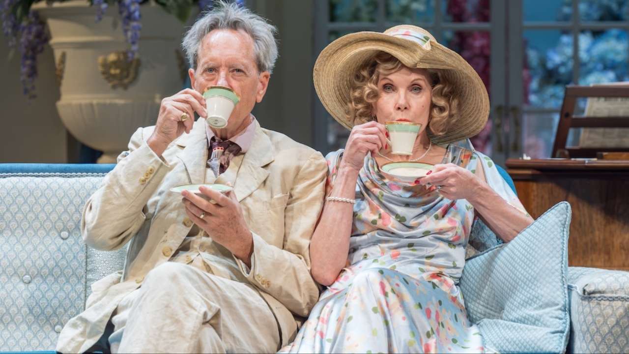 Richard E. Grant and Christine Baranski as David and Judith Bliss, sipping tea on stage in Noël Coward's Hay Fever at Wyndham's Theatre