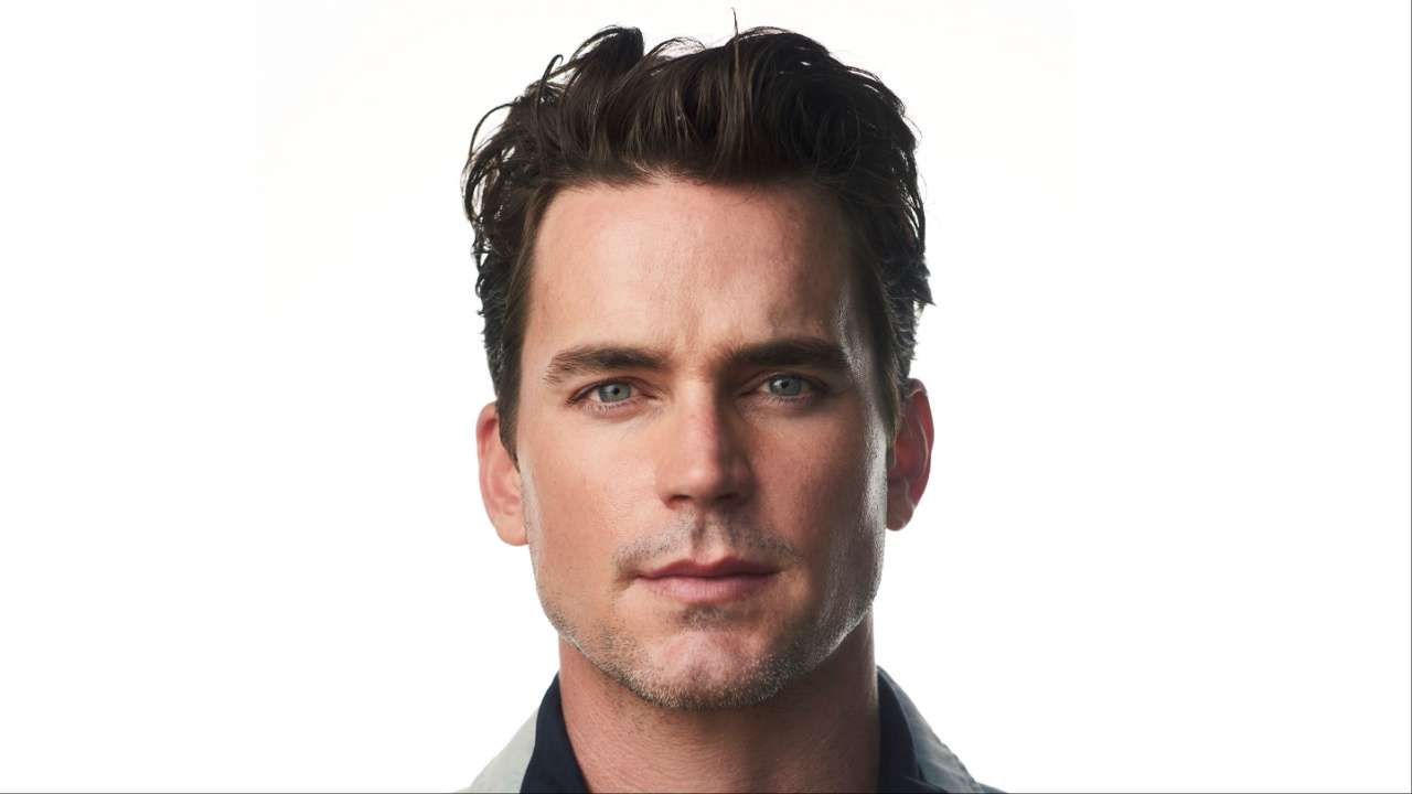 Photo of a man with dark hair against white background