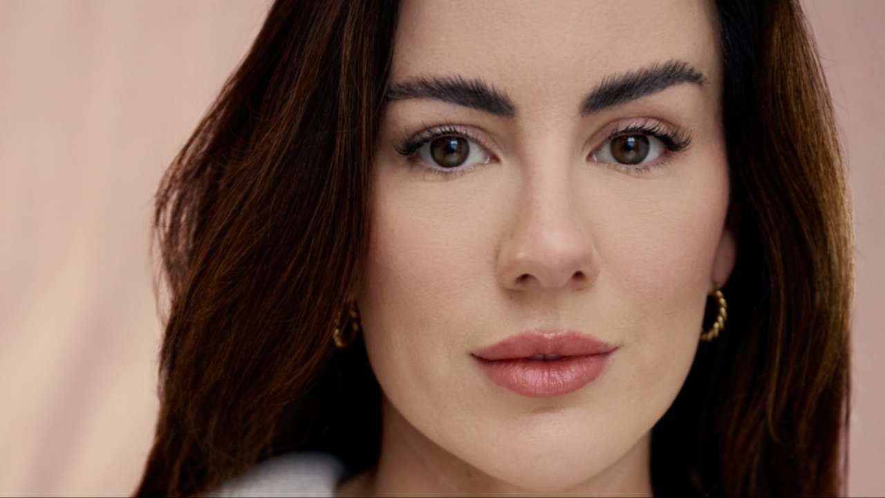 Close-up portrait of actress Sophie Craig, looking directly at the camera